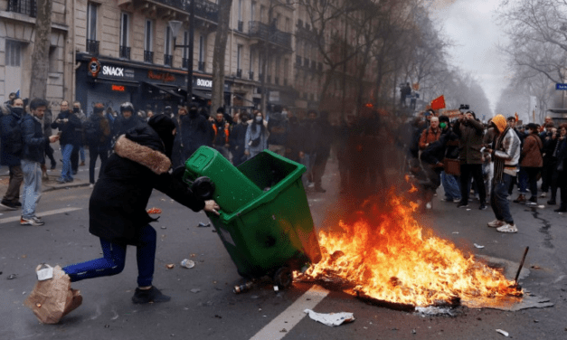 Embattled Macron heads to China, leaving burning Paris behind