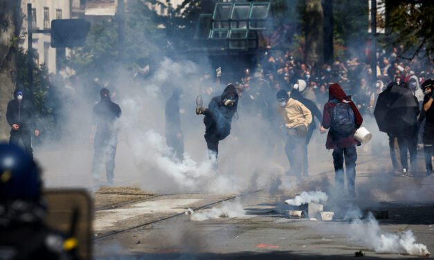 French police clash with black-clad anarchists during May Day rallies