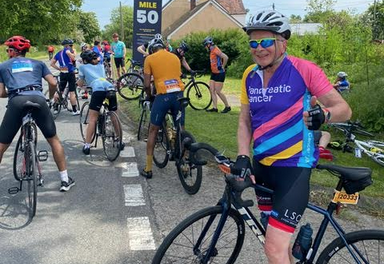 Charity bike rider Andrew Benson raises large sum for research