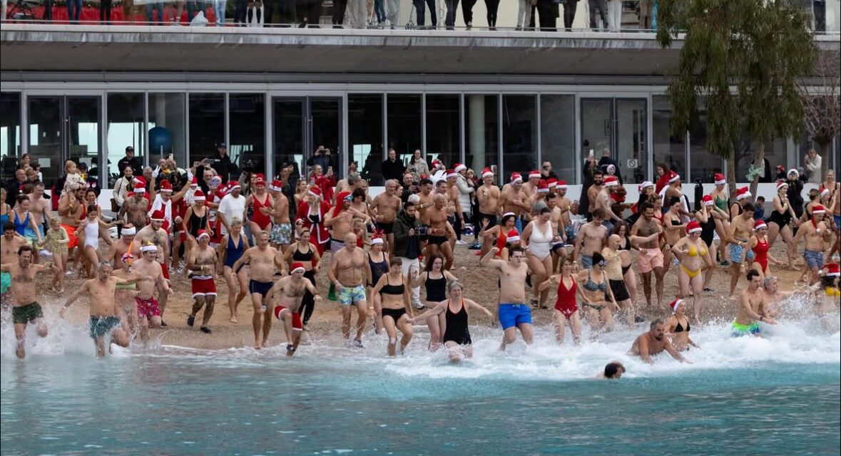 Cold water, warm hearts at Larvotto’s Christmas swim
